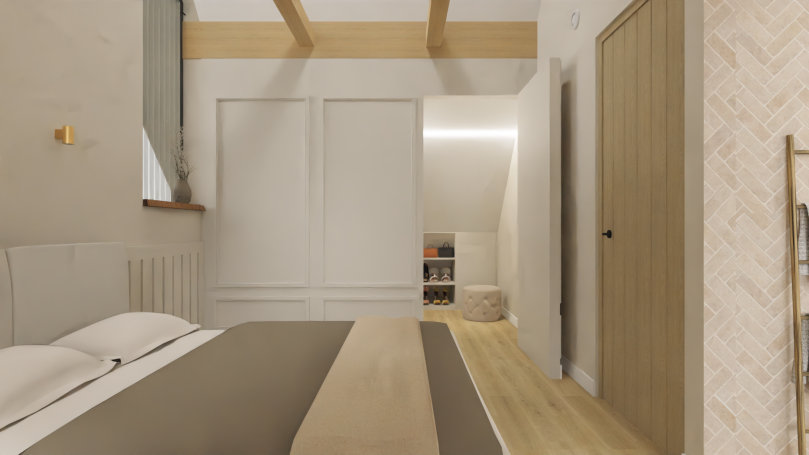 Slaapkamer inloopkast Slaapkamer met een bed, houten vloeren en een deur naar een andere ruimte.