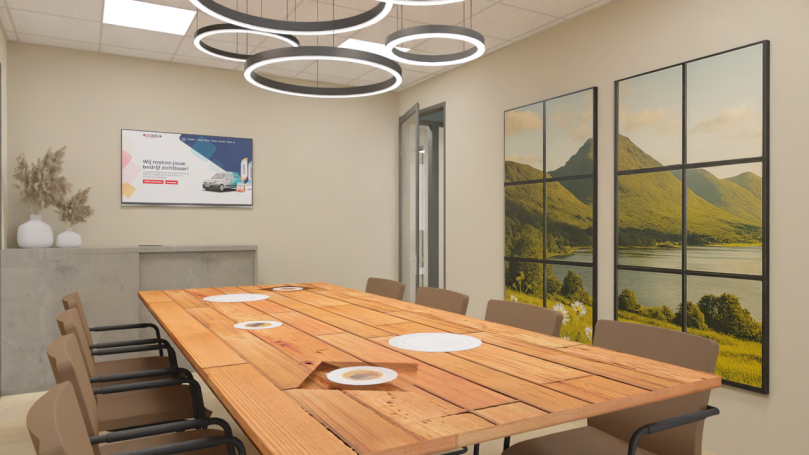Vergaderruimte Sfeervolle vergaderruimte met lange houten tafel en kunst aan de muur.