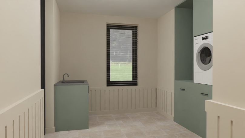 Bijkeuken Moderne wasruimte met groene kasten, een wasmachine en een gootsteen.