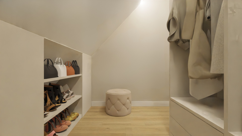 Slaapkamer inloopkast Minimalistische kledingruimte met schoenenplanken en een ronde poef.